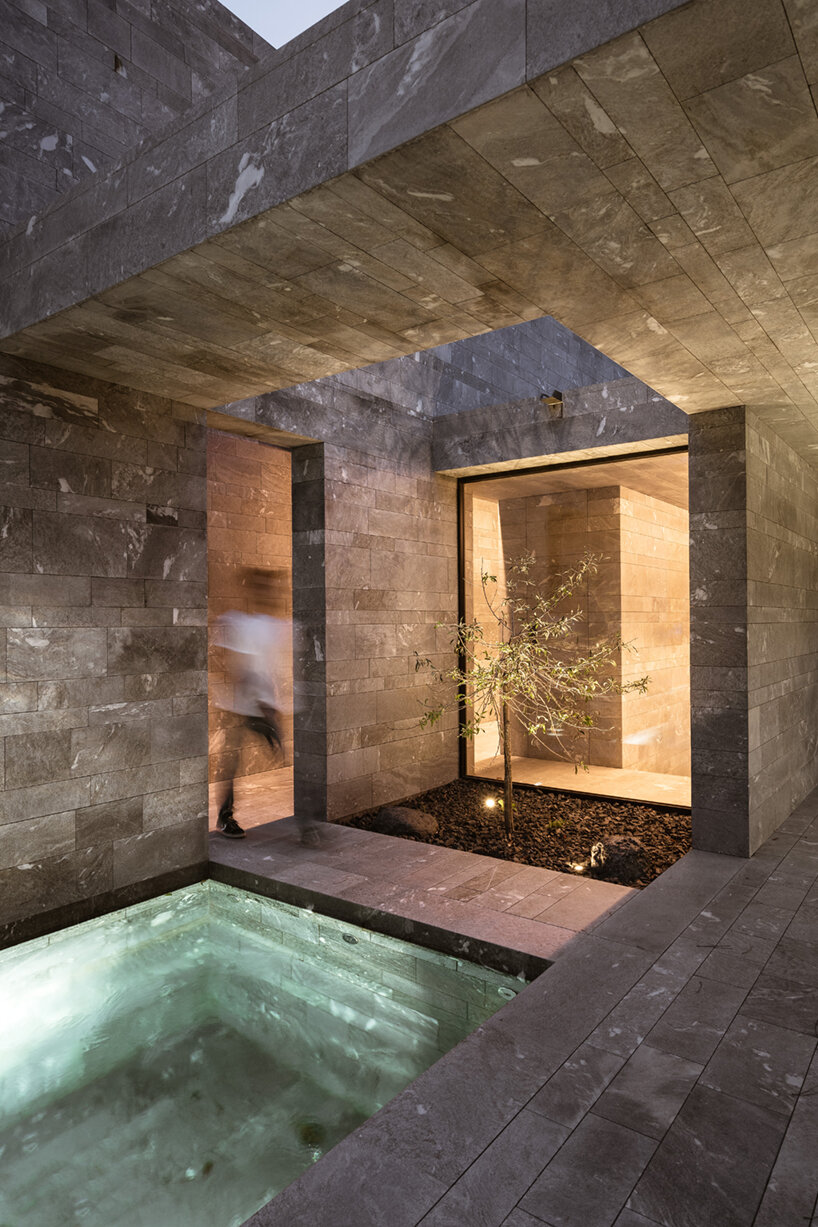 smartvoll's spa pavilion is a careful composition of monolithic stone slabs