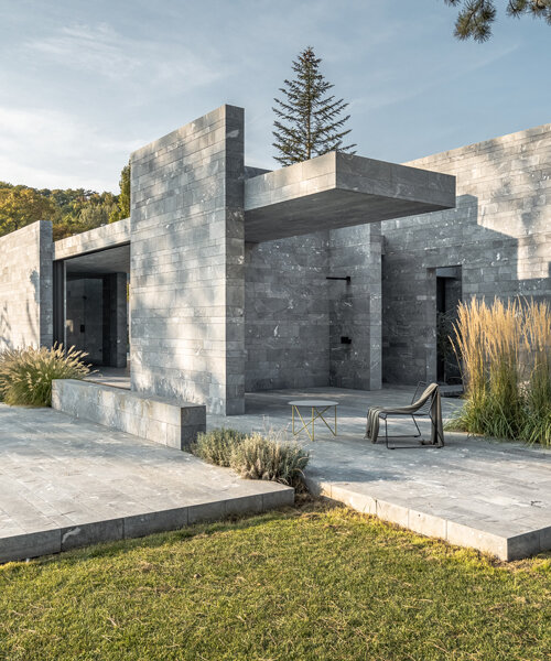 smartvoll's spa pavilion is a careful composition of monolithic stone slabs
