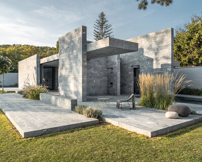 smartvoll's spa pavilion is a careful composition of monolithic stone slabs