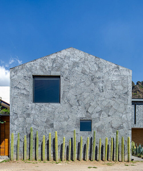 stone clad volumes form 'casa texcal' by HGR arquitectos within mexican countryside