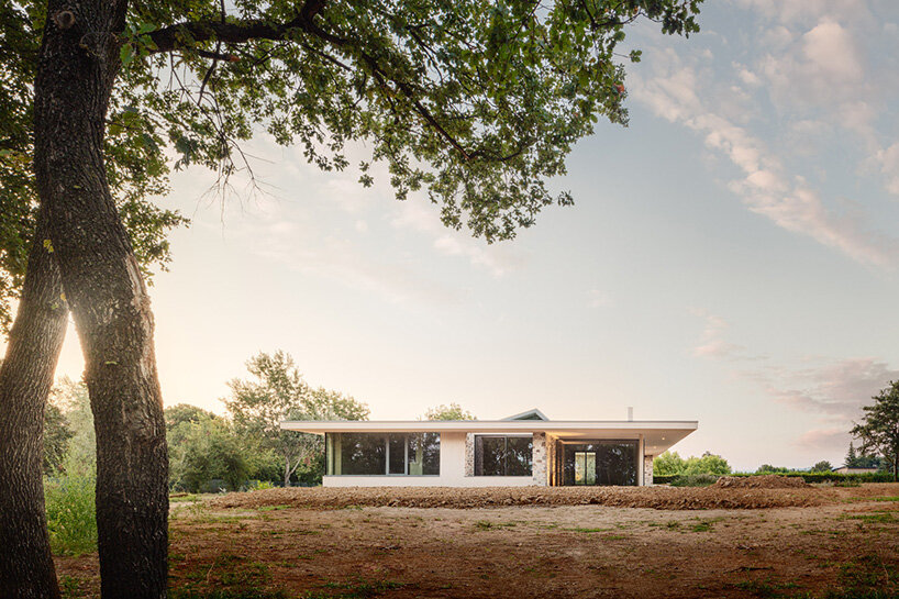 studio contini clads residential house in italy around three patios