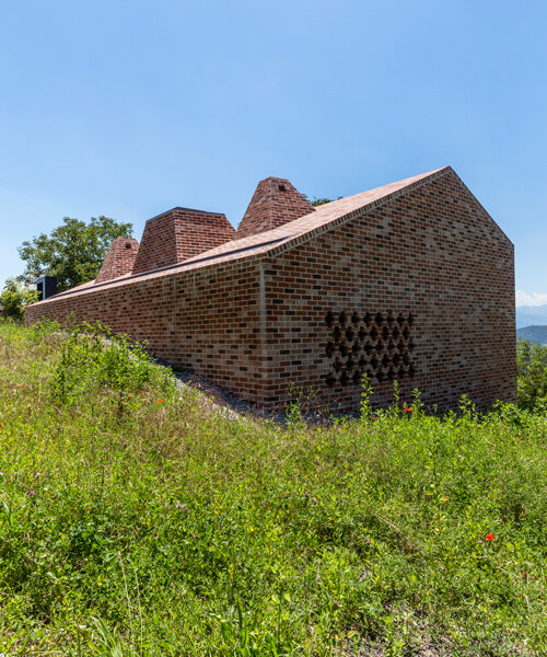 studioata embeds a faceted brick dwelling along the langhe hills of italy