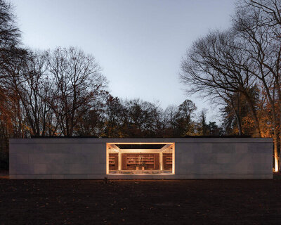 powerhouse company completes linear stone villa in the netherlands with central courtyard