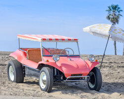 a pink volkswagen buggy has been refurbished in a vintage and beachy jolly-style