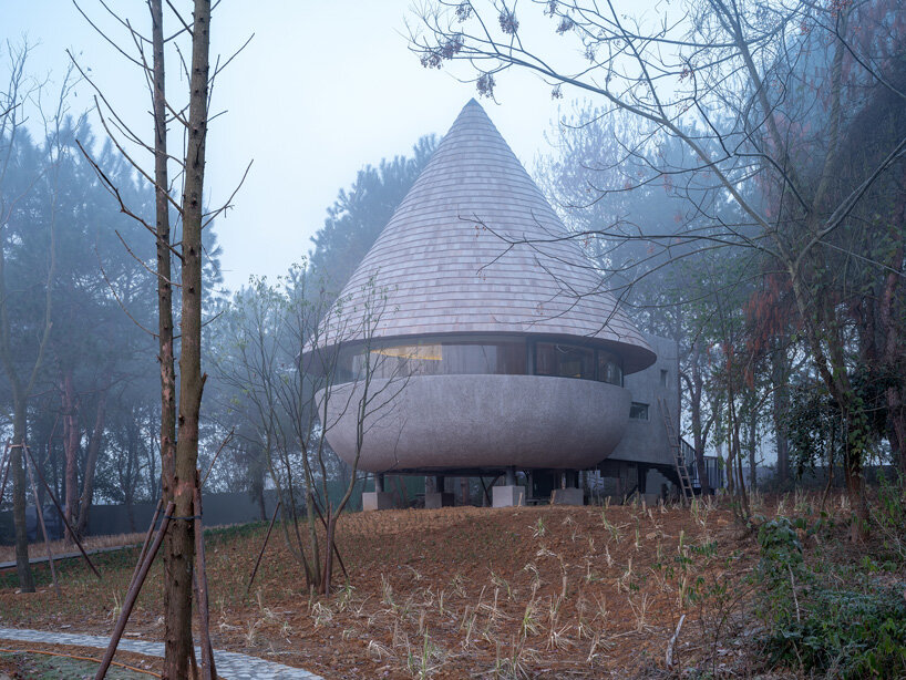 ZJJZ tops 'the mushroom' guest house with cone-shaped roof in china's jiangxi forest
