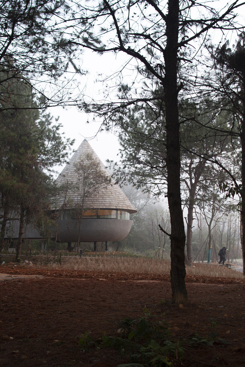 ZJJZ tops 'the mushroom' guest house with cone-shaped roof in china's jiangxi forest