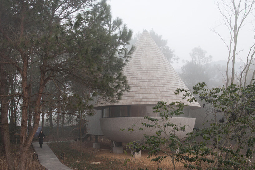 ZJJZ atelier tops 'the mushroom' guest house with cone-shaped roof in china's jiangxi forest