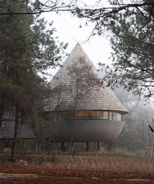 ZJJZ tops 'the mushroom' guest house with cone-shaped roof in china's jiangxi forest