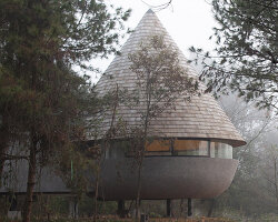 ZJJZ tops 'the mushroom' guest house with cone-shaped roof in china's jiangxi forest