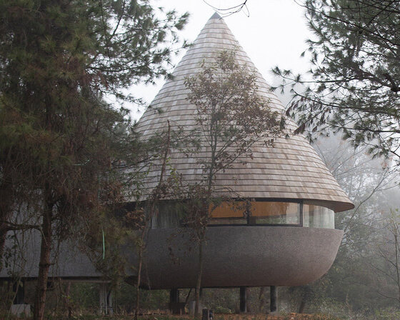 ZJJZ tops 'the mushroom' guest house with cone-shaped roof in china's jiangxi forest