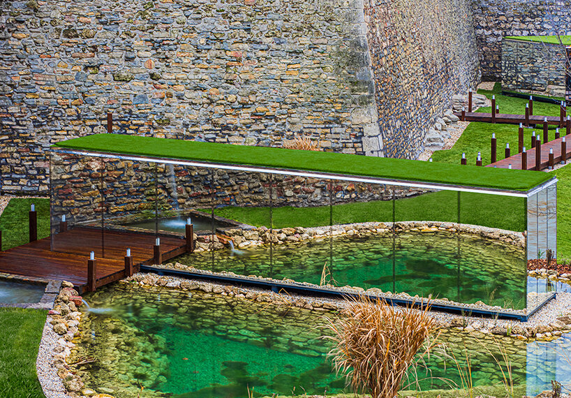 zoltan varro's mirrored spa occupies a 14th century castle moat in hungary