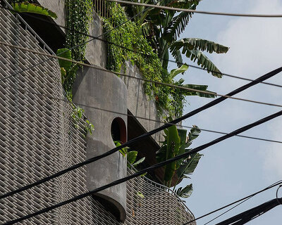H2 architects designs its plant-filled hoa's house with soft concrete geometries