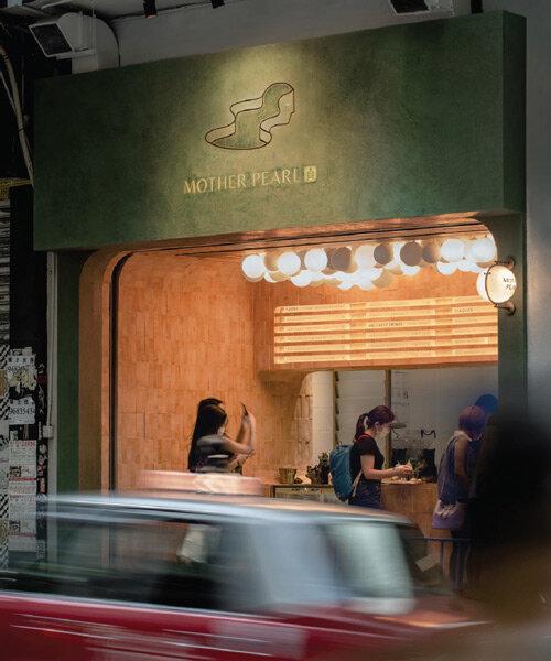 olive green and terracotta brick adorn a vegan bubble tea shop in hong kong