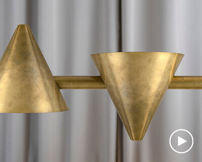 trio addi + örsjö introduce 'tell' modular cone-shaped brass luminaire
