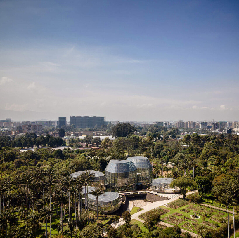 DARP blends cluster of floating glass volumes into the lush botanical garden of bogotá