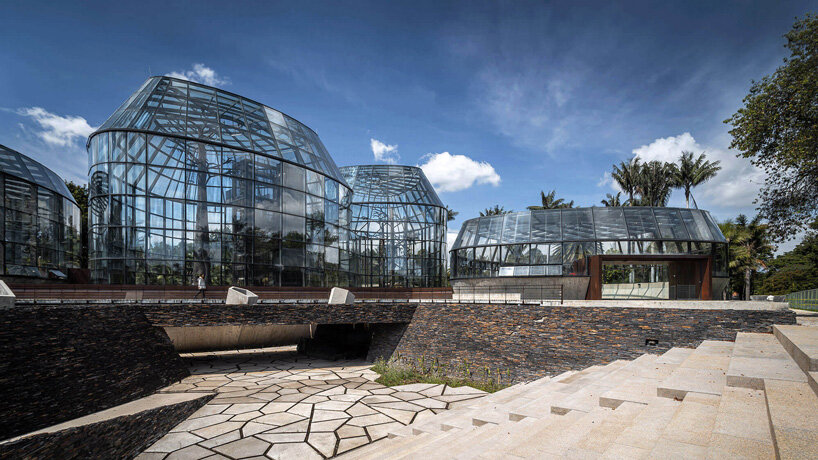 DARP blends cluster of floating glass volumes into the lush botanical garden of bogotá