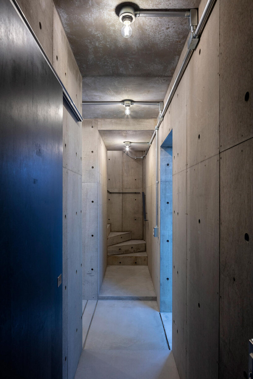 reflective curtains divide tokyo home's raw concrete interior by endo architect and associates