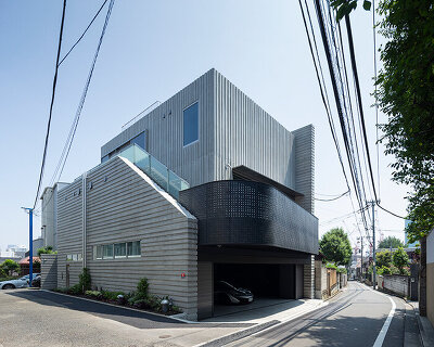 ribbed concrete façades wrap love architecture's 'extraordinary ordinary house' in tokyo