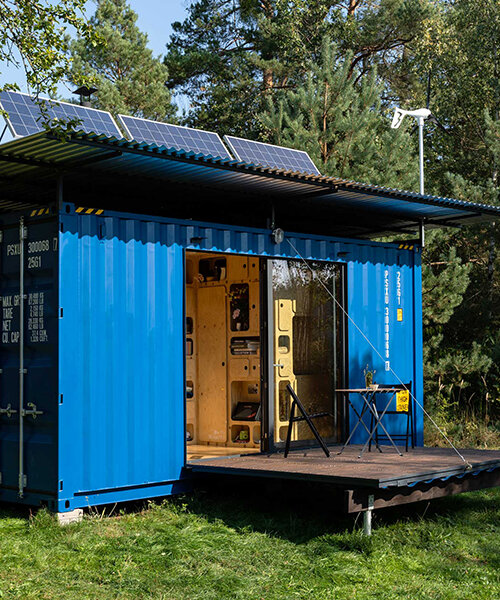 this tiny cabin made from an upcycled shipping container is completely self-sufficient