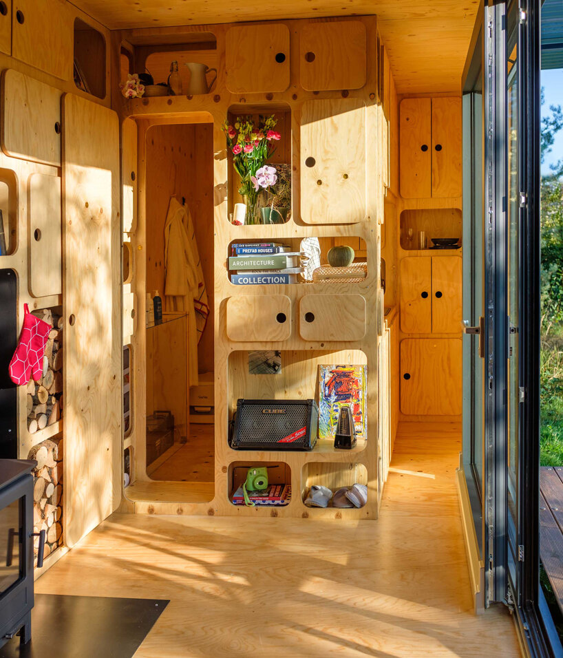 this tiny cabin made from an upcycled shipping container is self-sufficient