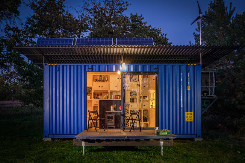 this tiny cabin made from an upcycled shipping container is self-sufficient