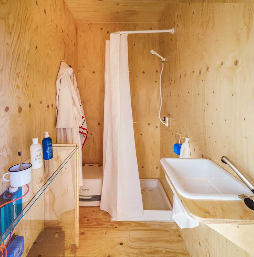 this tiny cabin made from an upcycled shipping container is self-sufficient