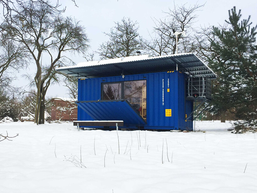 this tiny cabin made from an upcycled shipping container is self-sufficient