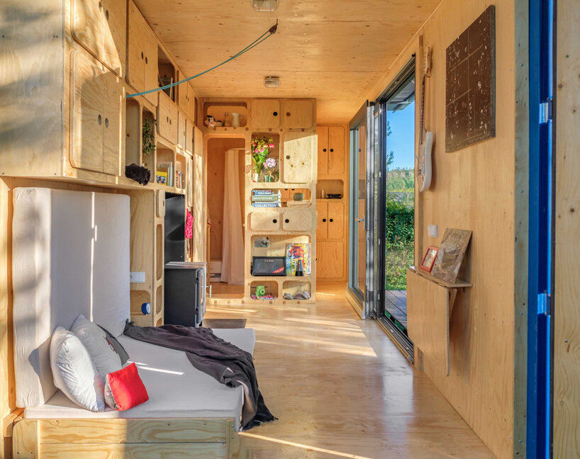 this tiny cabin made from an upcycled shipping container is self-sufficient