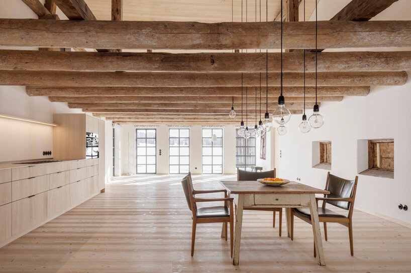 hafner bau converts historic german farmhouse into minimalist house that blends old + new