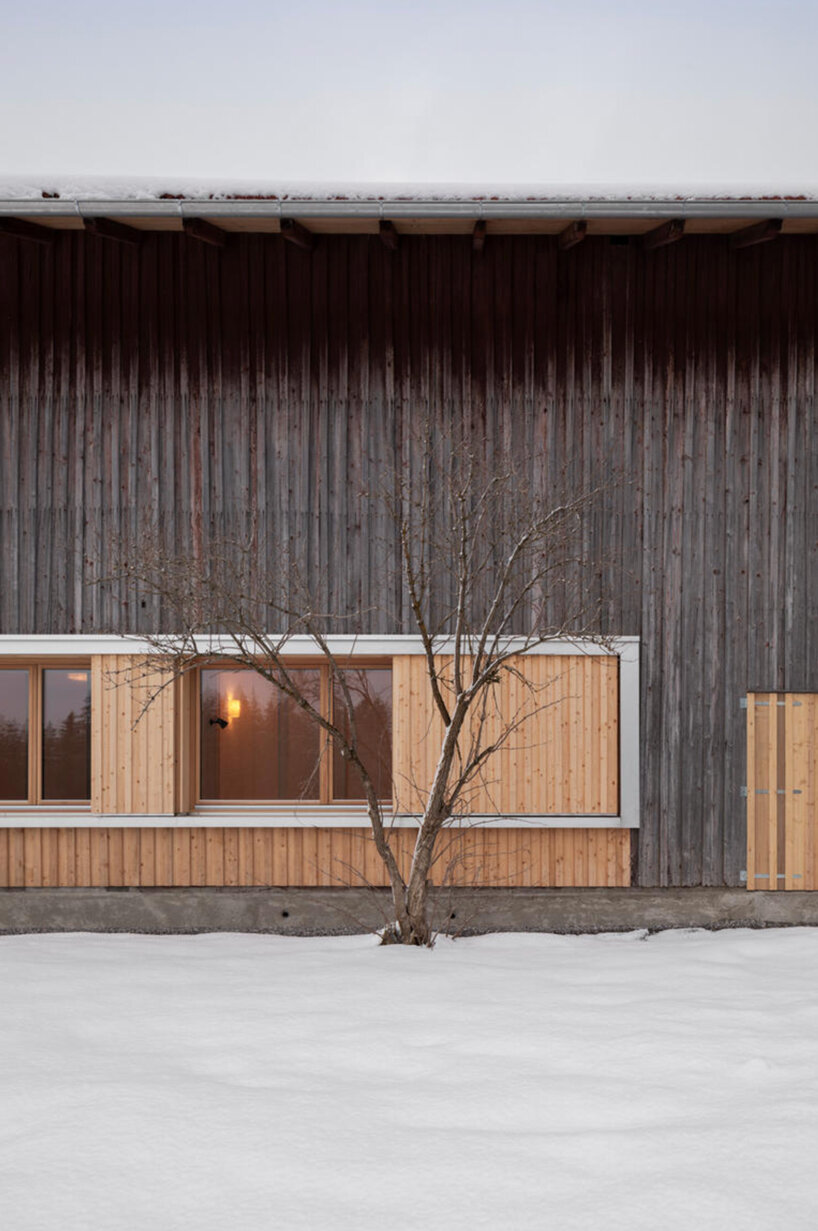 hafner bau converts historic german farmhouse into minimalist house that blends old + new