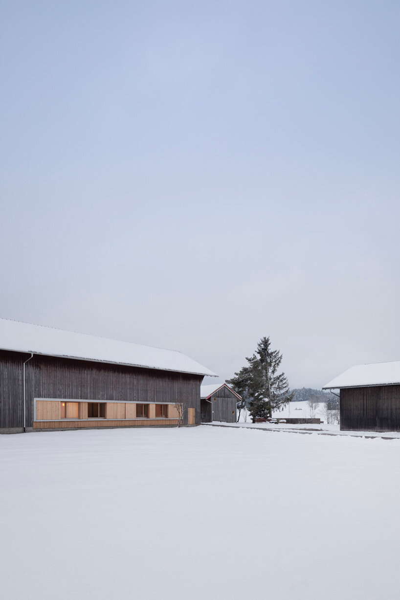 hafner bau converts historic german farmhouse into minimalist house that blends old + new