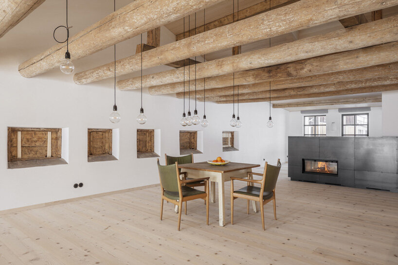 hafner bau converts historic german farmhouse into minimalist house that blends old + new