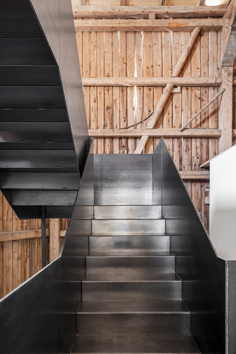 hafner bau converts historic german farmhouse into minimalist house that blends old + new