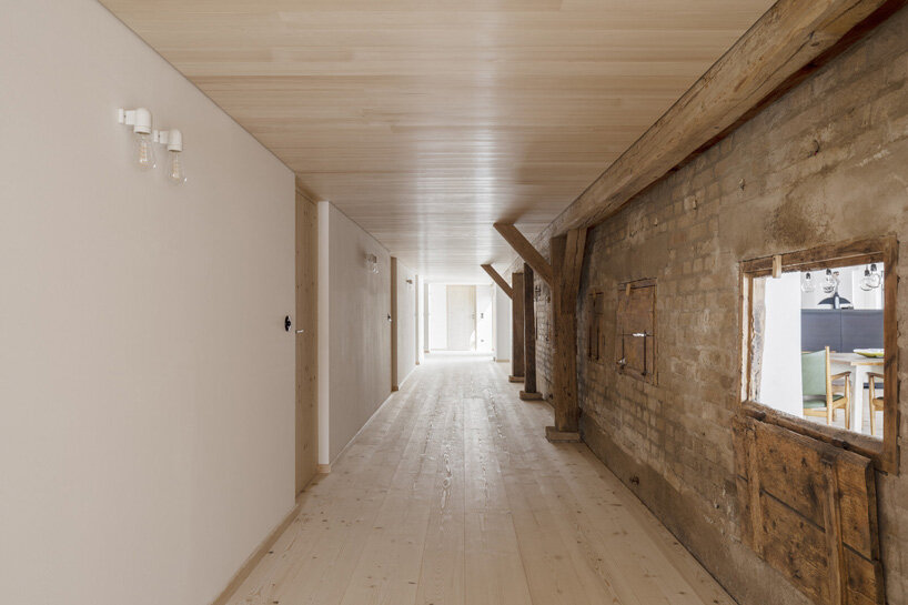 hafner bau converts historic german farmhouse into minimalist house that blends old + new