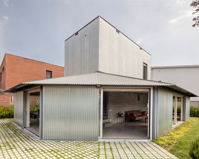 HARQUITECTES surrounds metal-clad house 905 with wide veranda in spain