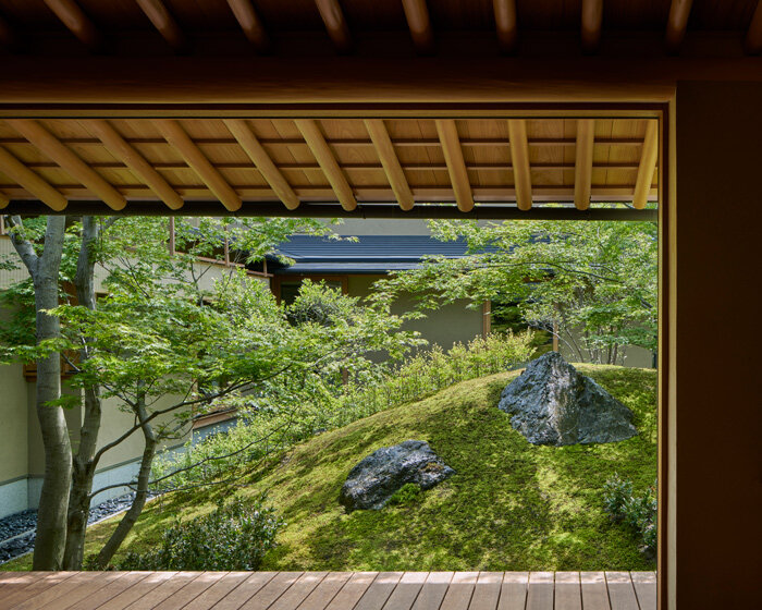 hiroshi nakamura & NAP articulate house in kyoto around courtyard with a sacred rock