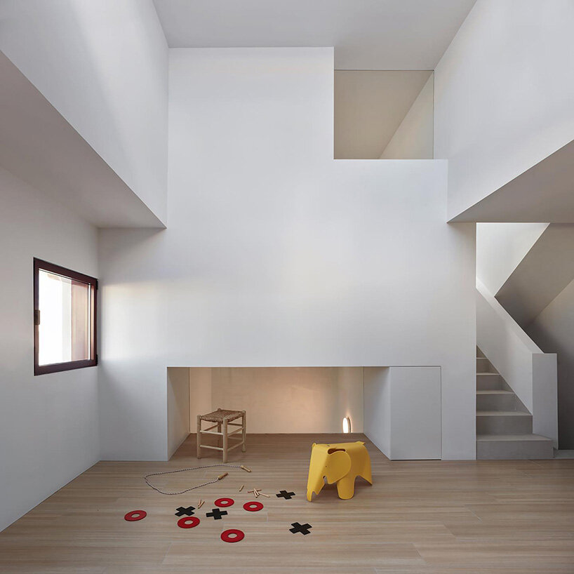 brick plinth contrasts with concrete curved mass in horma estudio's casa AA in spain