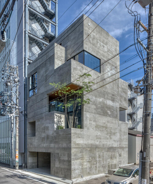 five-story atrium brings natural light into keitaro muto's concrete apartment building in japan