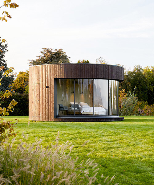 'LUMIPOD 6' prefab curved cabin connects occupants with lake geneva surroundings