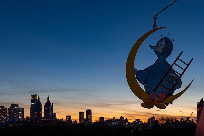 overlooking new york city, big bird rests on the moon in alex da corte's whimsical kinetic work on the met's roof garden
