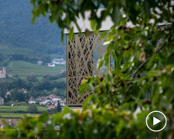 metallic bronze textured façade adorns dwelling by monovolume architecture+design, italy