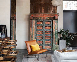 old carved door from india adorns boutique interior by modektura in ukraine