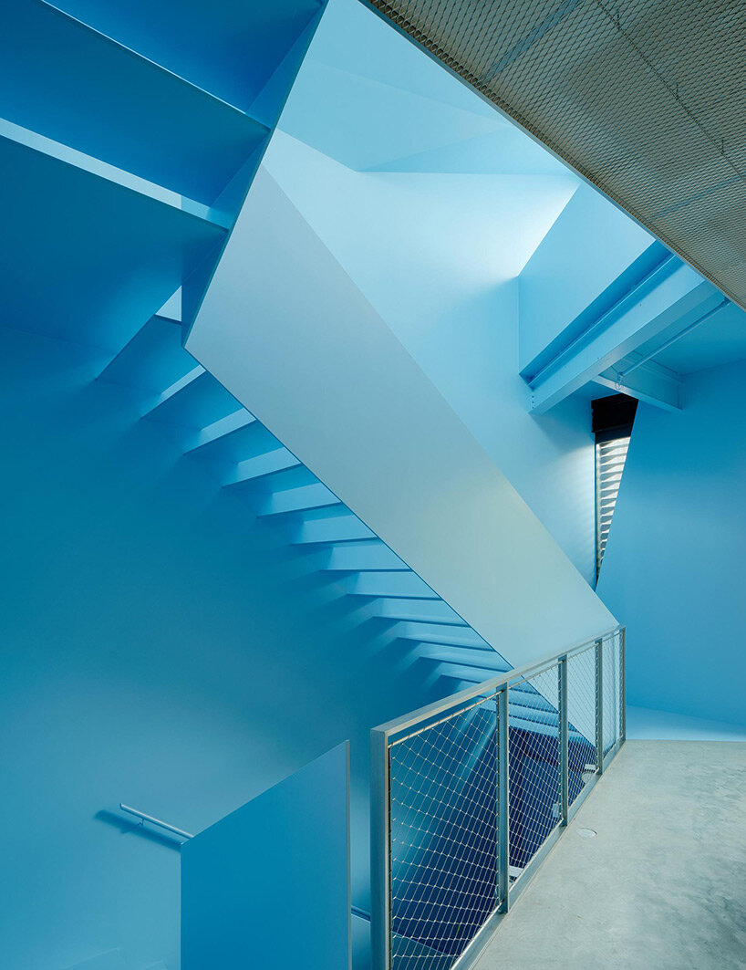 vibrant blue interior peeks through dense facade in san fransisco 'hidden house' by OPA