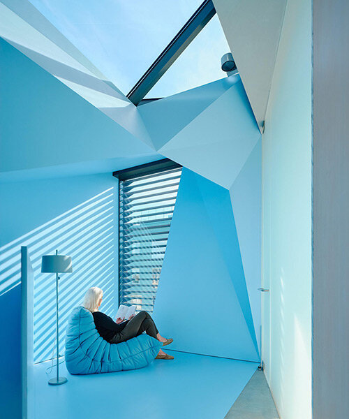 vibrant blue interior peeks through dense facade in san fransisco 'hidden house' by OPA