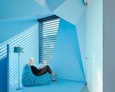 vibrant blue interior peeks through dense facade in san fransisco 'hidden house' by OPA