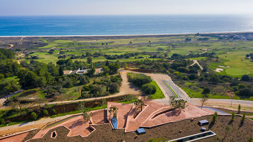 RCR arquitectes' palmares clubhouse in algarve suggests tectonic plates of red concrete
