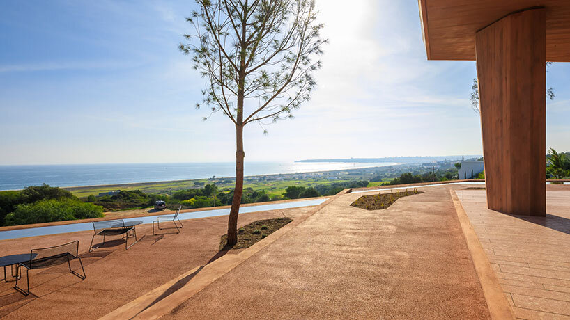 RCR arquitectes' palmares clubhouse in algarve suggests tectonic plates of red concrete
