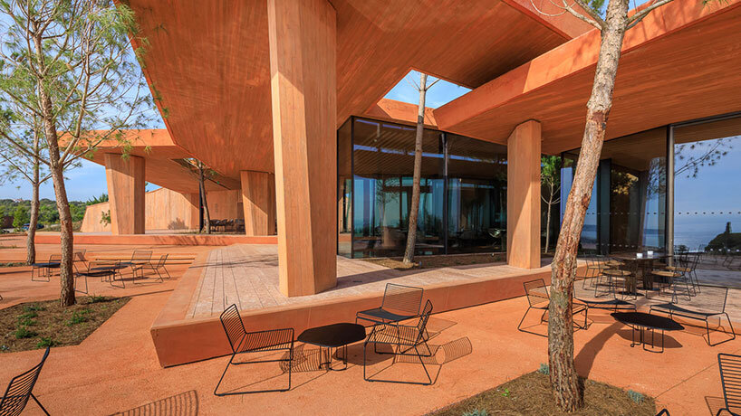 RCR arquitectes' palmares clubhouse in algarve suggests tectonic plates of red concrete