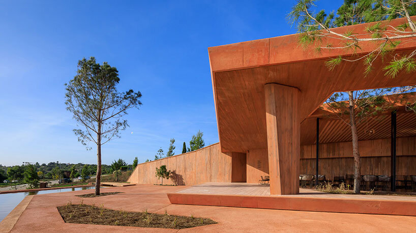 RCR arquitectes' palmares clubhouse in algarve suggests tectonic plates of red concrete
