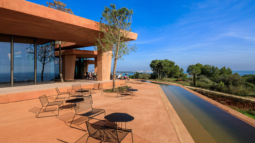 RCR arquitectes' palmares clubhouse in algarve suggests tectonic plates of red concrete